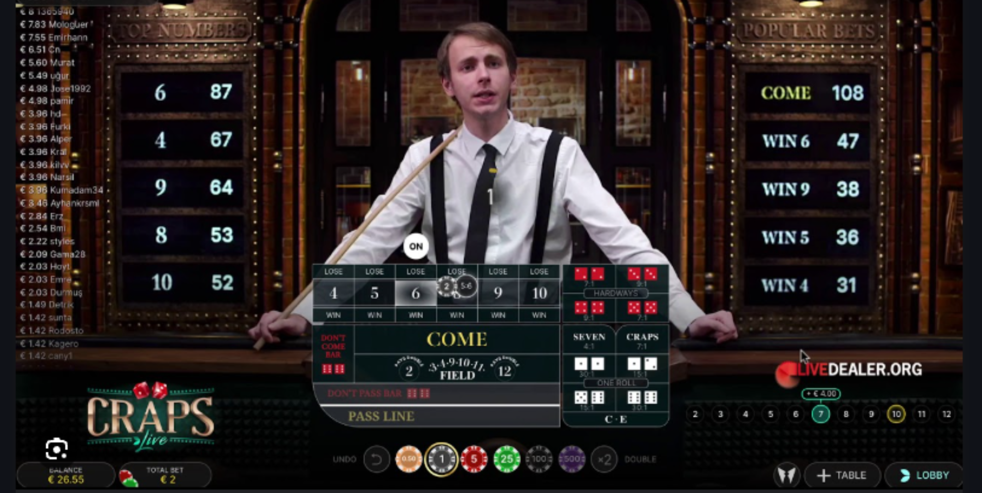 Live online craps game with real dealer and betting layout by Evolution, featuring top numbers and player bets in real time