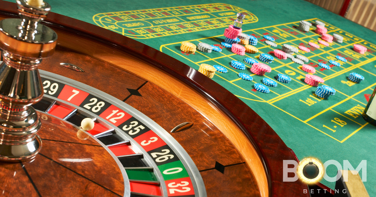Close-up of a roulette wheel with betting chips on a green casino table, representing online roulette gameplay in Canada